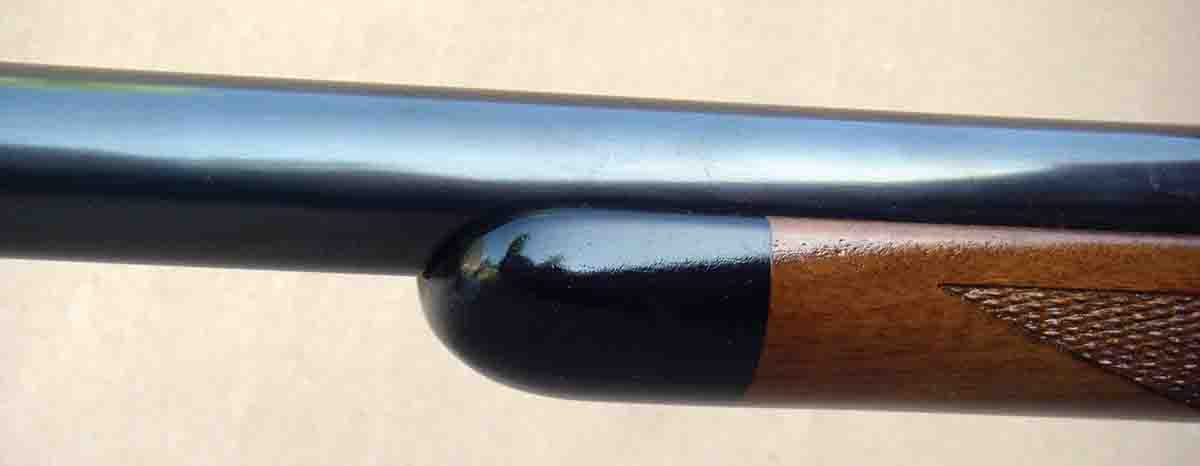 The forend cap is made of black ebony.